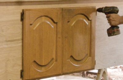 Attach the doors and paint the coop