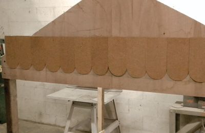 Start attaching shingles to the gable