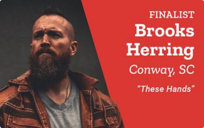 Finalist. Brooks Herring. Conway, South Carolina. These Hands. A promotional banner featuring a portrait of Brooks Herring with a beard and mohawk hairstyle standing in a dimly lit setting.