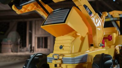 Image showing  CAT Pedal Tractor with Front Loader and Backhoe Ride-On Toy, High Impact Blow Molded Body, Ages 3 and Up