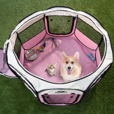 PETMAKER Portable Pop-Up Pet Play Pen with Carrying Bag Line the bottom of this little pen with pee pads, and you're good to go!