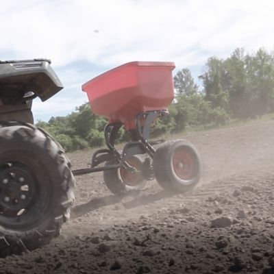 Image showing  150 lb. Capacity Poly Hopper Auto-Stop Tow-Behind Spreader