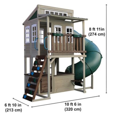 Image showing 6 th KidKraft Cozy Escape Wooden Playhouse with Slide, Rock Wall and Play Kitchen
