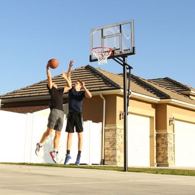 Image showing 7 th Lifetime In-Ground Steel-Frame Basketball Hoop with Action Grip Adjust, 52 in.