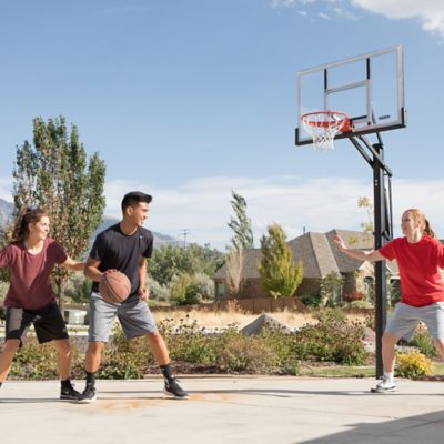 Image showing 7 th Lifetime Adjustable In-Ground Basketball Hoop, 54 in. Acrylic