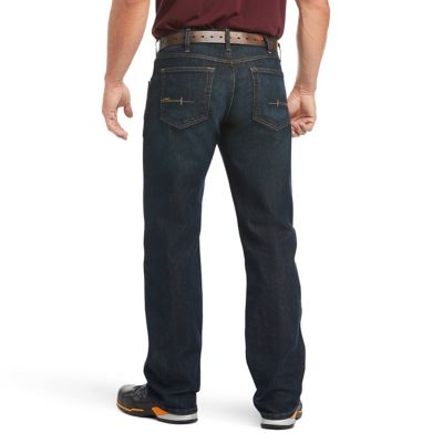 Image showing 1 th Ariat Men's Stretch Fit Low-Rise Rebar M5 Slim DuraStretch Edge Stackable Straight Leg Jeans, Dark Blue