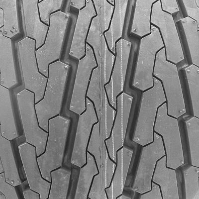Image showing  20.5x8.0-10 (205/65D10) 8 Ply Highway Rib Tire and 4 on 4 Stamped Wheel Assembly
