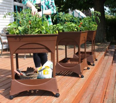 Image showing  Easy Picker Raised Bed Self-Watering Garden Grow Box with 30 in. Stand, Includes Casters and Supply Storage Grate