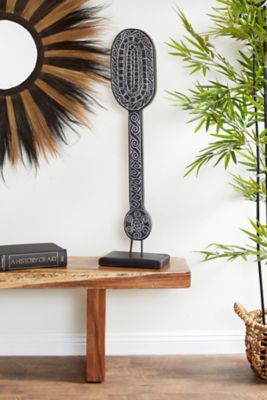 Harper & Willow 10.5 in. x 40 in. Hand-Carved Tribal Paddle Wood Sculpture, Reclaimed Wood Stand, Black