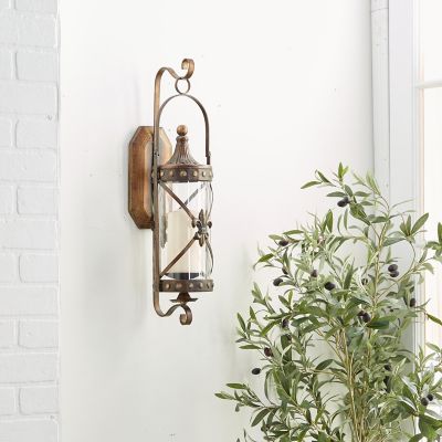 Harper & Willow Metal Lantern Wall Sconce with Fleur-De-Lis and Hurricane Glass, 7 in. x 6 in. x 20 in.