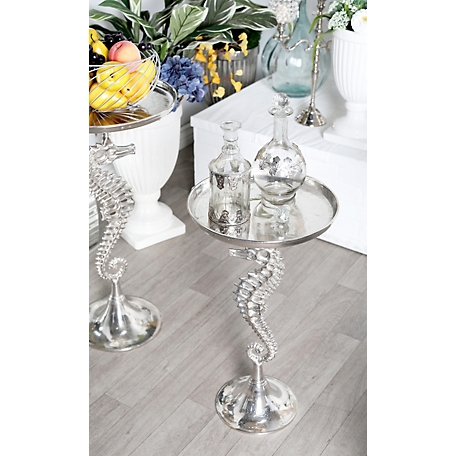 Harper & Willow 16 in. x 29 in. Coastal Style Metallic Silver Aluminum Seahorse Side Table with Round Top