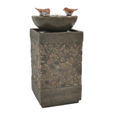 Image of Birdbath filled with water in amended topsoil