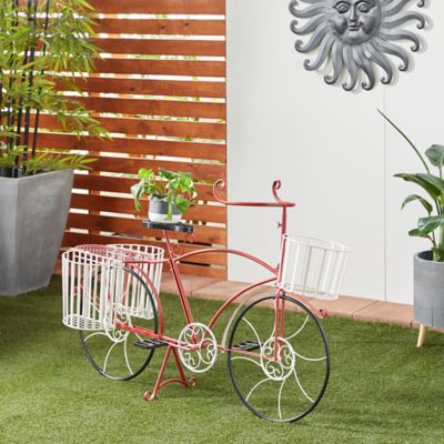 Harper & Willow Red Metal Indoor Outdoor Bike Plantstand with Basket and Saddle Bag Planters 52 in. x 18 in. x 33 in.