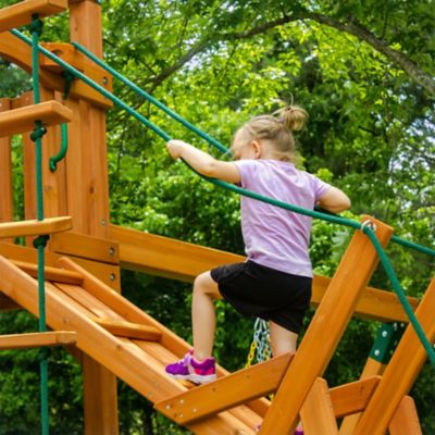 Image showing 7 th Gorilla Playsets Pioneer Peak Wood Swing Set with Green Vinyl Canopy, 22 ft. 6 in. x 23 ft. x 11 ft.