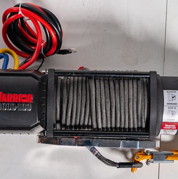 Image showing  10,000 lb. Capacity Elite Combat Severe-Duty Electric Winch with Armortek Synthetic Rope, 22.6 x 6.3 x 10.2 in.