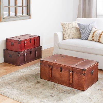 Harper & Willow Brown Wood Nesting Upholstered Trunks with Vintage Accents and Studs, 32 in./29 in./26 in., 3 pc.