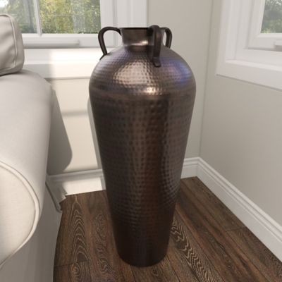 Harper & Willow Brown Metal Tall Floor Mediterranean Style Vase with Hammered Details and Handles, 12 in. x 12 in. x 32 in. Beautiful vase and fits the space perfectly