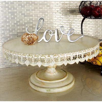 Harper & Willow White Metal Cake Stand with Lace Inspired Edge, 22 in. x 22 in. x 10 in.