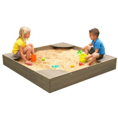 Image of Child playing in sandbox with amended topsoil