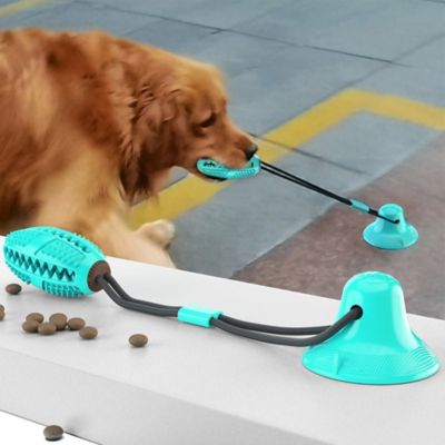 Image showing  Grip N Play Treat Dispensing Football-Shaped Suction Cup Dog Toy