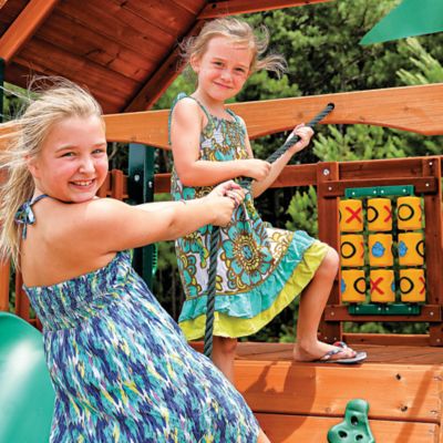 Image showing 5 th Gorilla Playsets Chateau Wooden Swing Set, Includes Slide, Picnic Table, Rock Wall and Playset Accessories