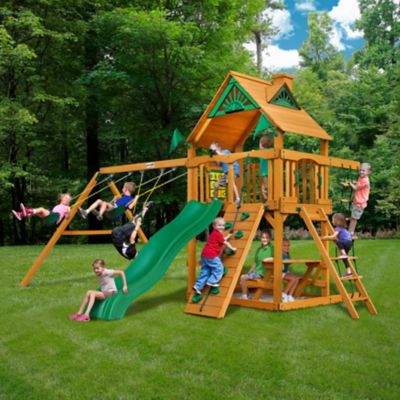 Image showing 8 th Gorilla Playsets Chateau Wooden Swing Set, Includes Slide, Picnic Table, Rock Wall and Playset Accessories