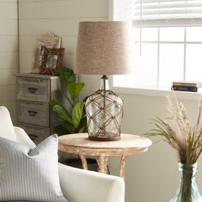 Harper & Willow Clear Glass Table Lamp with Brown Woven Rattan Exterior 15 x 15 x 29in.
