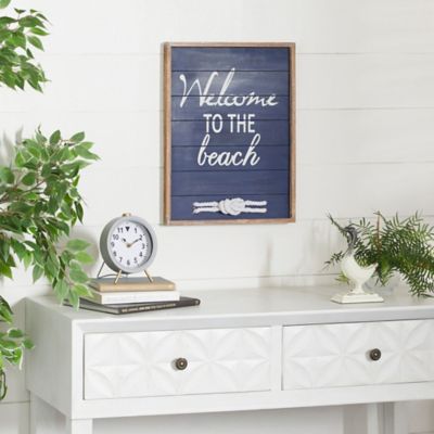Harper & Willow Blue Wood Welcome To The Beach Sign Wall Decor 15 in. x 2 in. x 19 in.