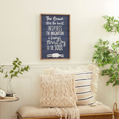 Harper & Willow Blue Wood Ocean Sign Wall Decor with Knotted Ropes 16 in. x 2 in. x 24 in.