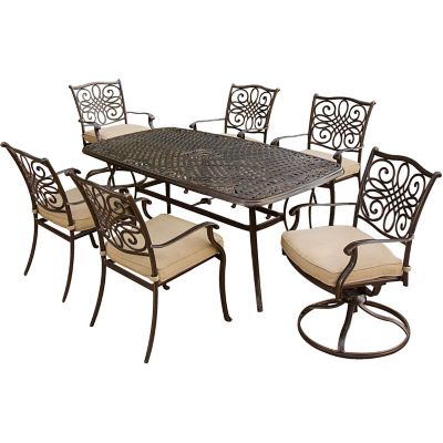Cambridge Seasons 7-Piece Outdoor Dining Set in Tan with Four Dining Chairs, Two Swivel Chairs and a 38 x 72 in. Table