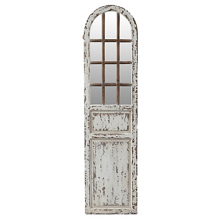 Fragment of a wooden door painted with white paint. Decorative
