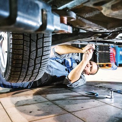 Remove Oil And Grease Stains From Your Garage Floor Tractor