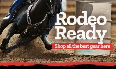 Promotional banner for rodeo gear sale. Text reads Rodeo Ready. Shop all the best gear here. Image features a close up of a rider on a galloping black horse turning around a barrel in a dirt rodeo arena.