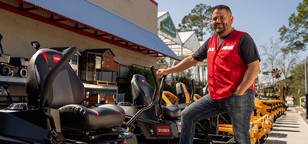 Tractor Supply team member outside the store.