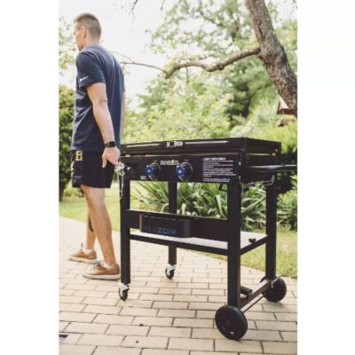 Image showing  2-Burner Propane Gas Flat Top Griddle with Side Shelves, Condiment Tray and Wind Guards, 450 sq. in., Black