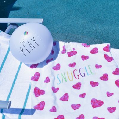 Image showing  Snuggle Kids Hooded Towel & 12 in. Beach Ball - Hearts 48 in. x 24 in. Poncho