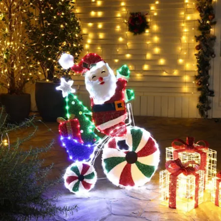 LuxenHome Santa on Bicycle Peppermint Lighted Holiday Decoration Christmas Statues