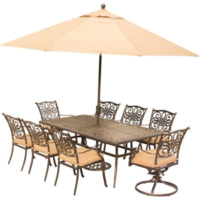 Hanover Traditions 9 pc. Dining Set in. Tan with Extra-Long Cast-Top Dining Table, 11 ft. Table Umbrella, and Umbrella Stand