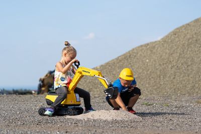 Image showing  Komatsu Crawler Excavator Ride-On with Opening Seat and Helmet, Ages 3 and Up, Yellow