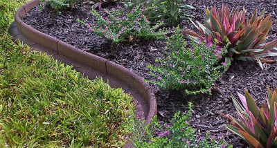 Image showing  Recycled Rubber Flexible 4ft Lawn Edging L-shape, 6 pc. Box, Brown