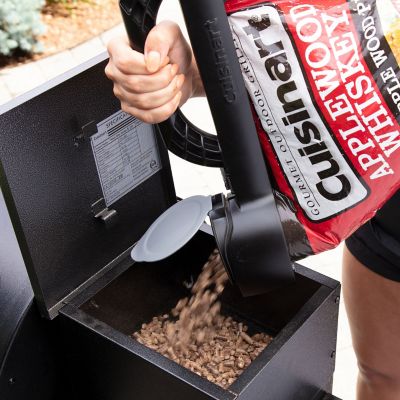 Image showing  BBQ Wood Pellet Dispenser Bag Clip with Integrated Seal Cutter, Carry Handle, and Pour Spout in Black
