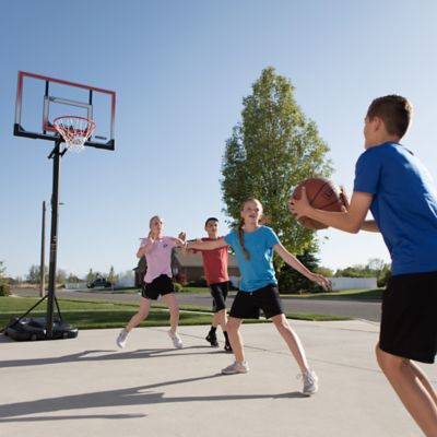 Image showing 8 th Lifetime 50 in. Adjustable Portable Basketball Hoop, Red/Clear