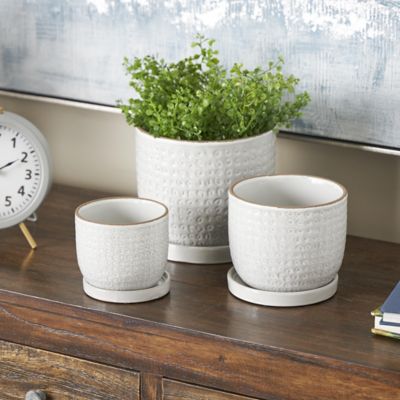 Harper & Willow Ceramic Abstract Circle Patterned Indoor Outdoor Planter with Brown Accents and Base Tray