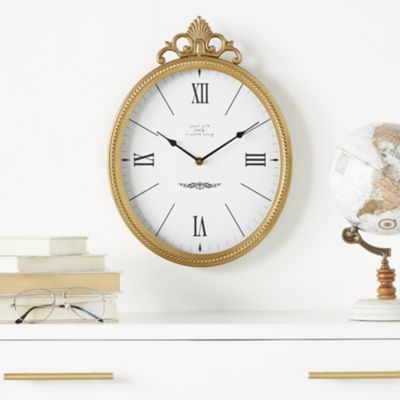 Harper & Willow Metal Antique Inspired Scroll Decorative Wall Clock with Finial