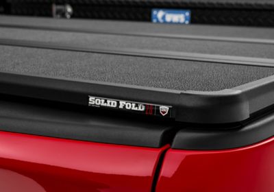Image showing 6 th RealTruck Extang Solid Fold 2.0 Toolbox Hard Folding Tonneau Ram 6.4ft 19-25, New Body Style-does not fit with split tailgate
