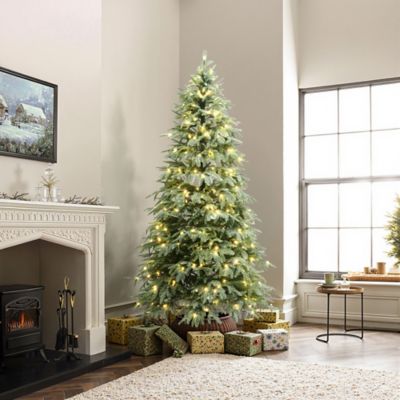 Image showing 5 th LuxenHome 6.5 ft. Pre-Lit Green PE Branches Artificial Spruce Christmas Tree with Metal Stand