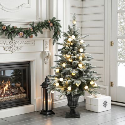 Image showing  4 ft. Pre-Lit Snow-Flocked Artificial Christmas Tree in Brushed Silver Urn Pot
