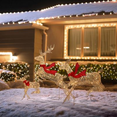 Image showing 2 th LuxenHome 3-Piece Champagne Gold PET Running Deer Family Outdoor Holiday Decoration with Lights