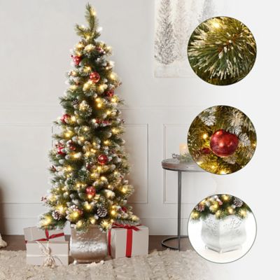 Image showing  5 ft. Pre-Lit Artificial Pine Christmas Tree with Pinecones and Snowflake Planter Pot