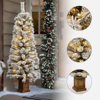 Image showing  Artificial 5 ft. Pre-Lit Flocked Fir Christmas Tree in Square Planter, Indoor Holiday Accent
